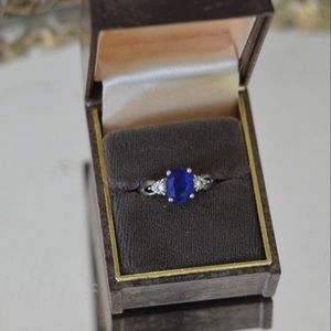 Oval cut large blue sapphire sterling silver adjustable ring with clear stones